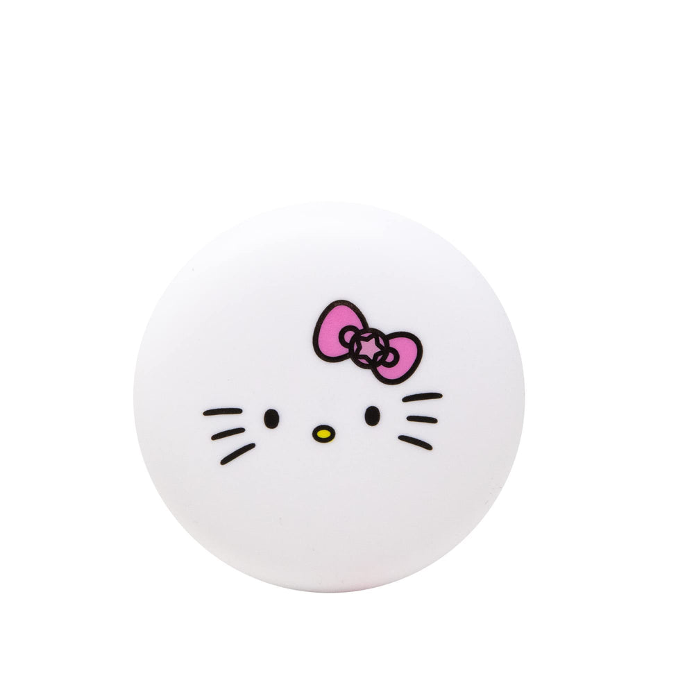 The Crème Shop Hello Kitty Macaron aroma pastel de cumpleaños para labios felices.
