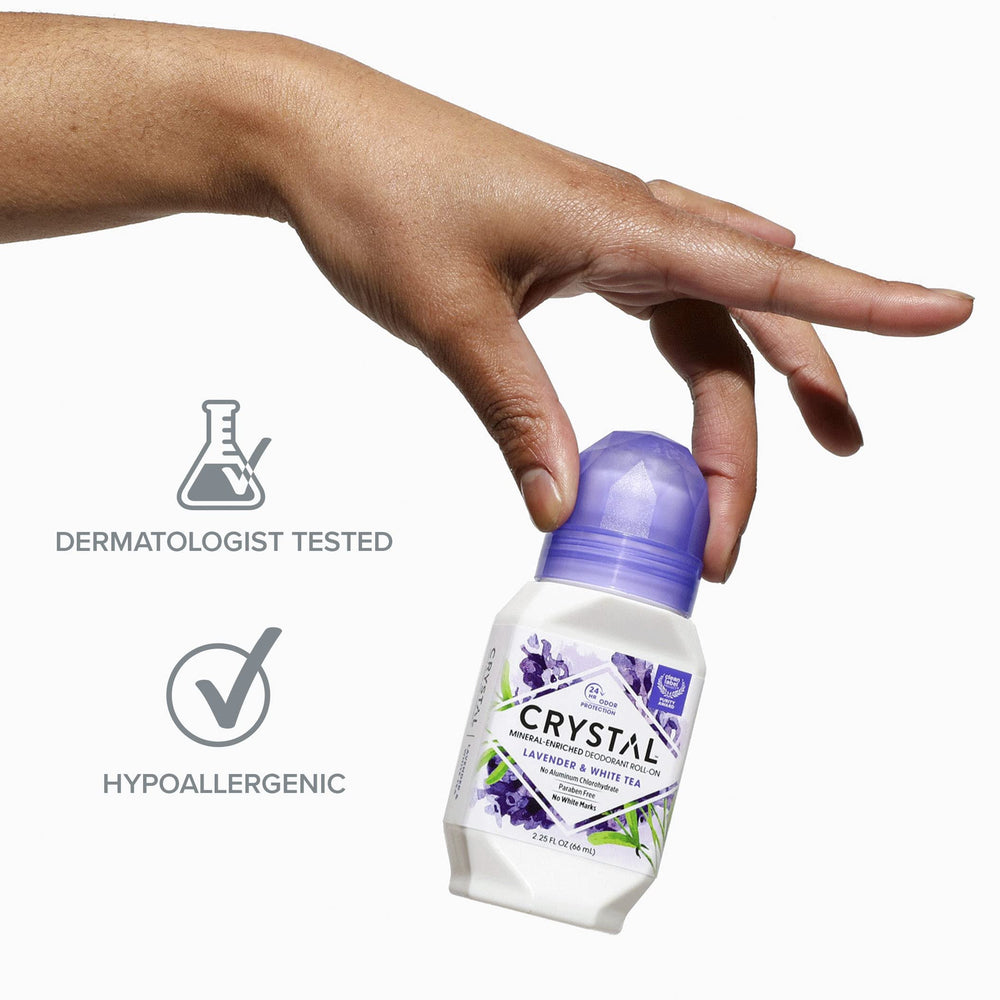 Envase morado de Crystal Essence con etiqueta clara