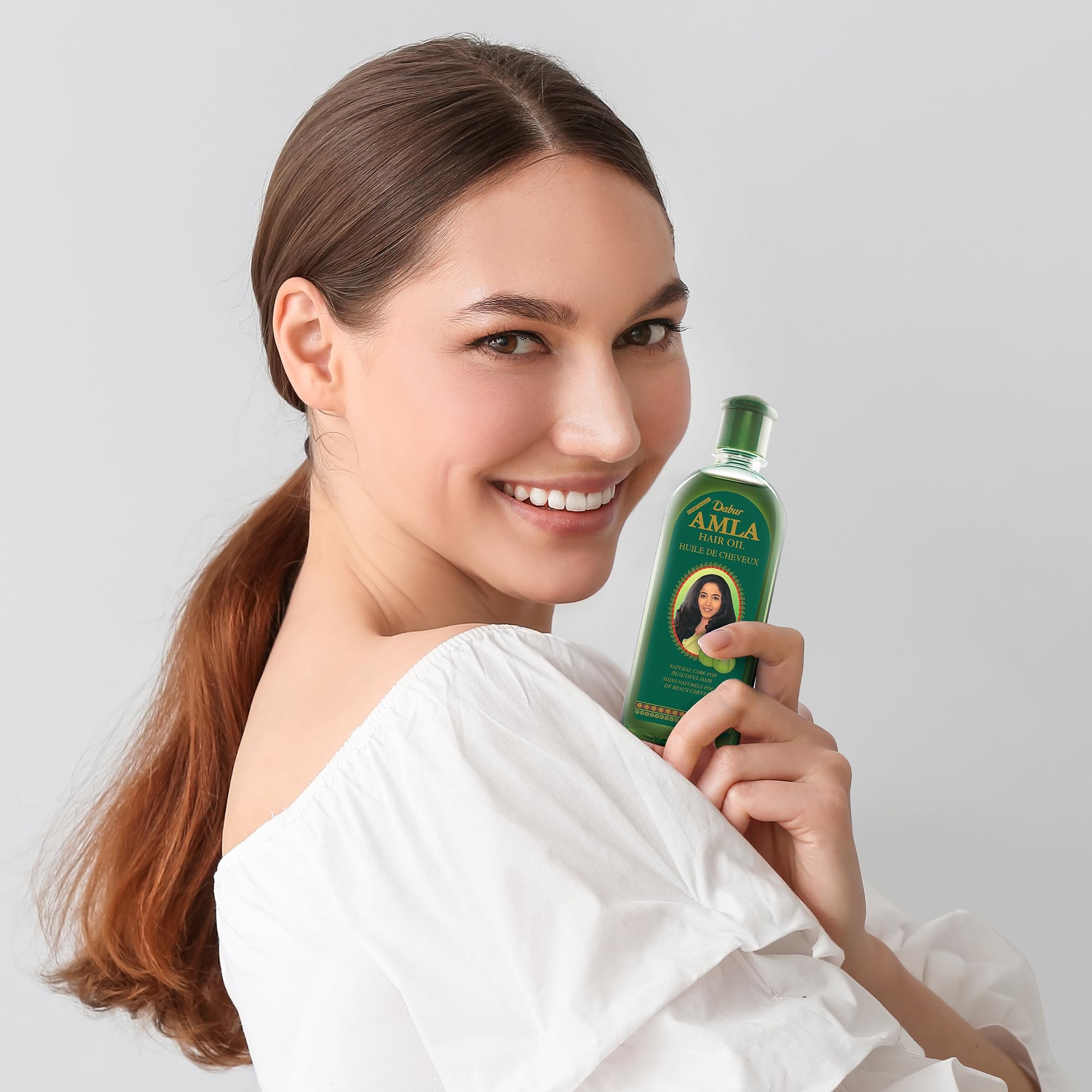 Dabur Amla Hair Oil ingredientes naturales cuidan suavemente
