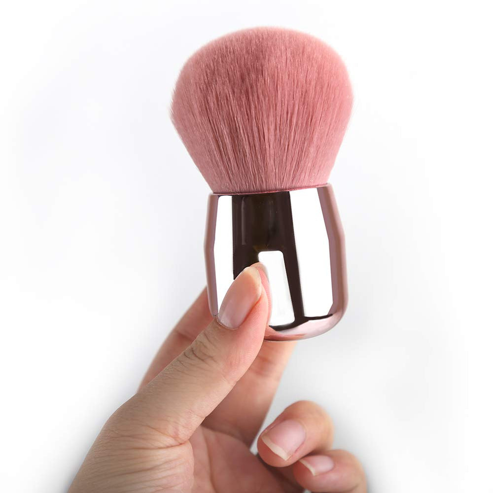 Pincel Daubigny Kabuki rosa grande con fibra sintética para cobertura uniforme.