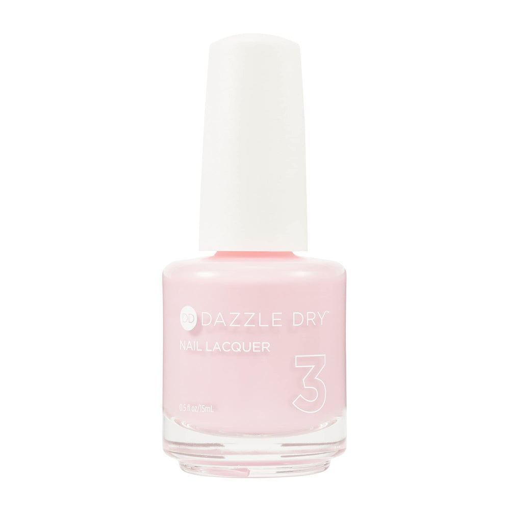 Dazzle Dry Girlishly Giddy: botella de esmalte rosa claro, acabado cremoso y secado rápido.