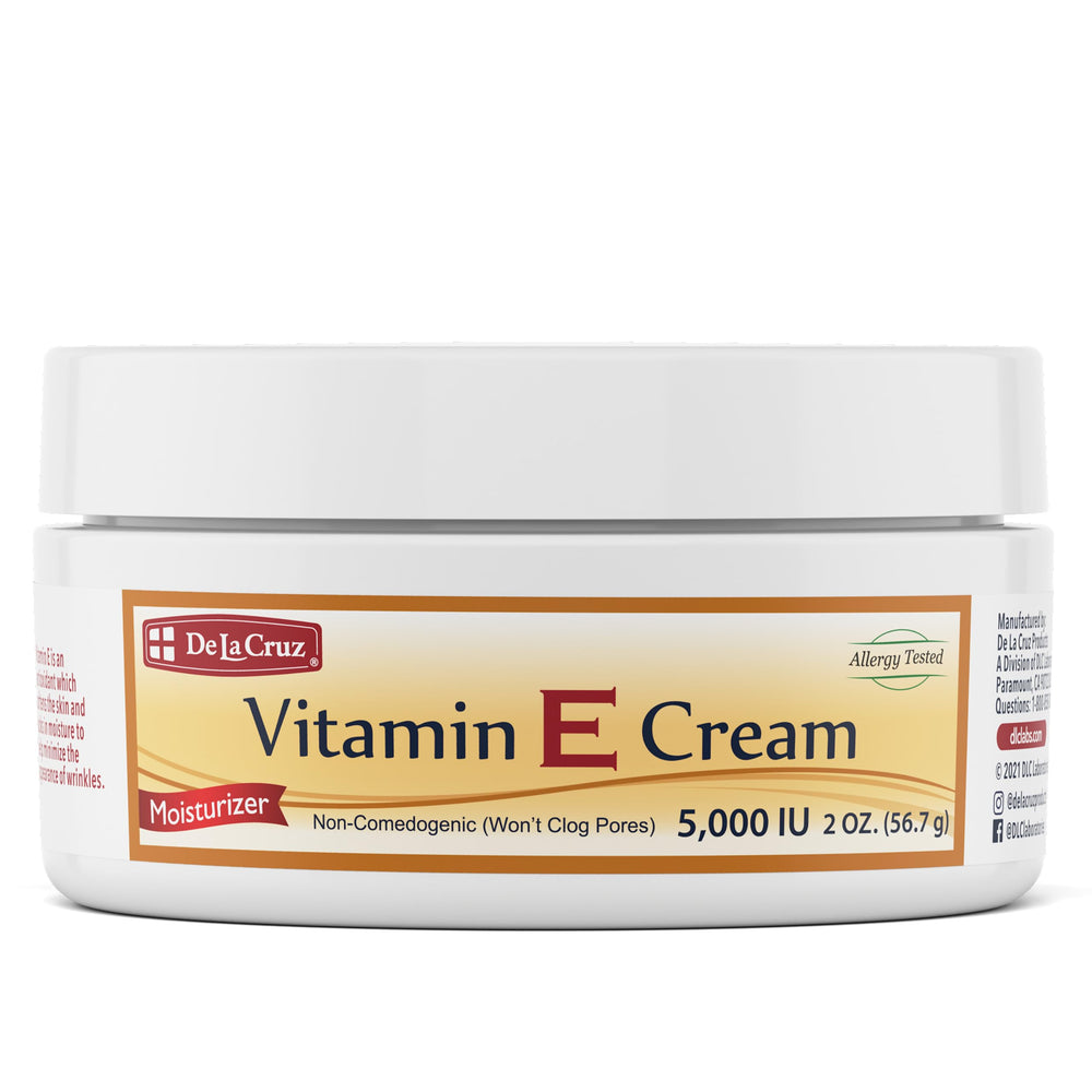 De La Cruz Vitamina E Crema, bote frontal, hidratación suave para piel seca.