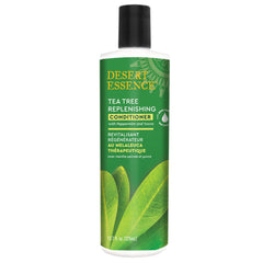 Desert Essence Tea Tree Condicionador, botella vertiendo, promete suavidad al peinado.