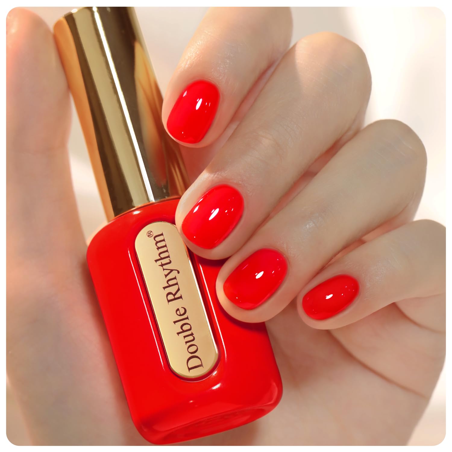 Double Rhythm Esmalte Gel Rojo Neón en frasco dorado, color vibrante para uñas modernas