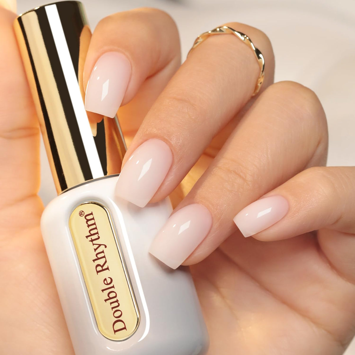 Double Rhythm frasco dorado translúcido de gel para uñas, acabado elegante