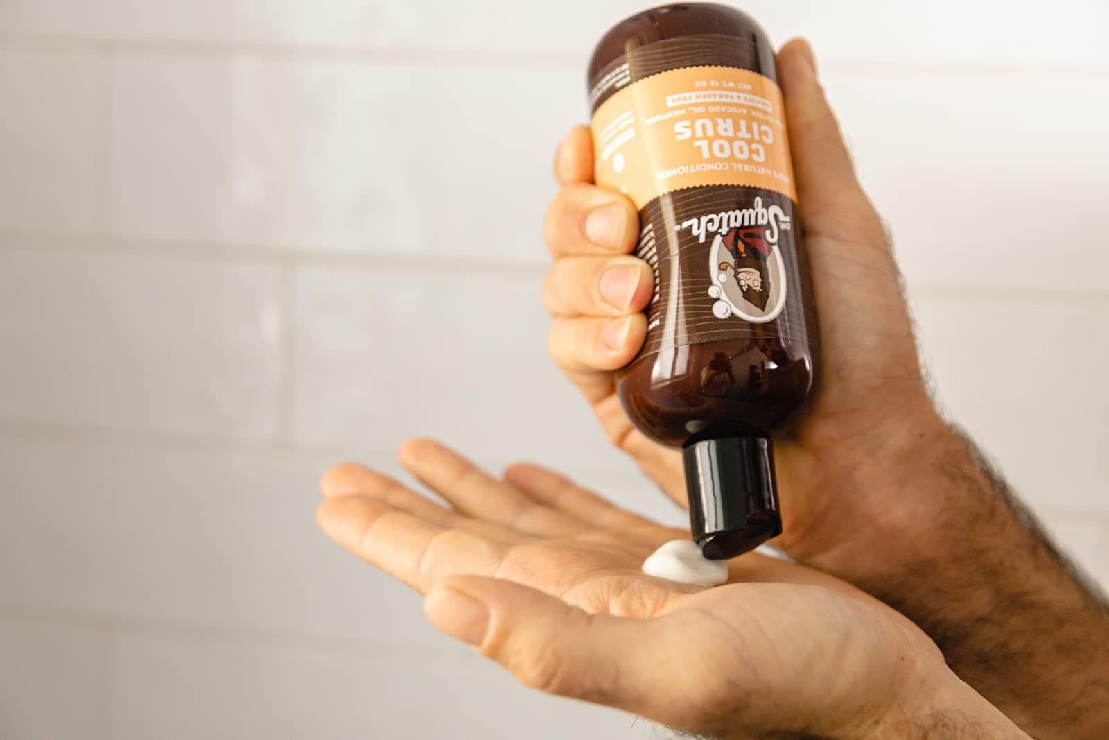 Dr. Squatch Cool Citrus Conditioner label highlights organic peppermint and soothing calendula