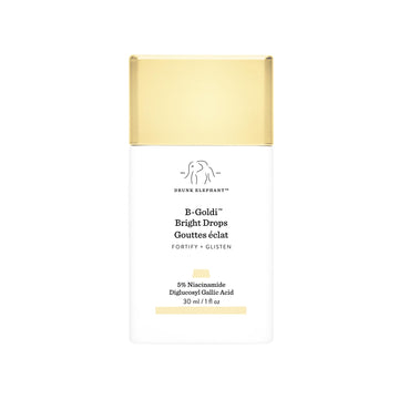 Drunk Elephant B-Goldi Bright Drops en botella con brillo dorado suave para piel radiante.