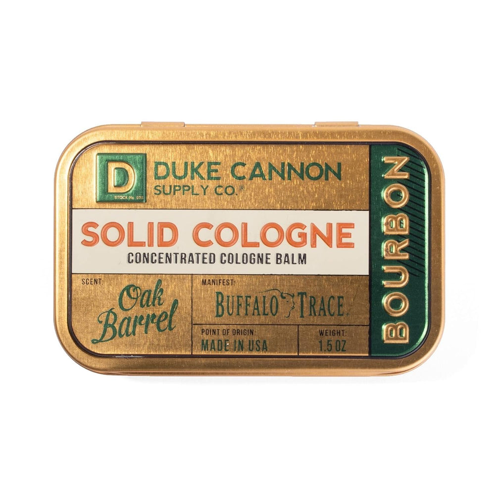 Duke Cannon Bourbon solid cologne packaging, rugged and portable for travelers.