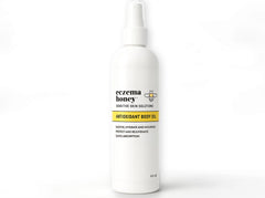 ECZEMA HONEY Aceite corporal antioxidante en botella para piel sensible.