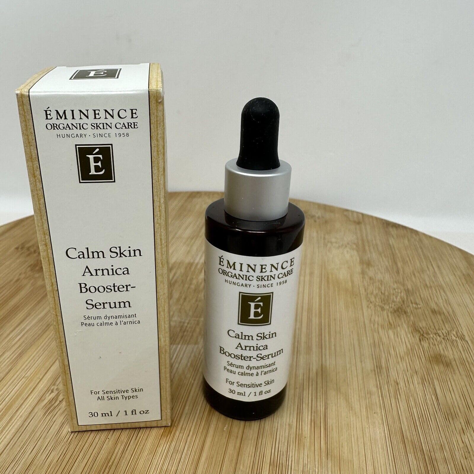 Envase de vidrio del serum de árnica Eminence