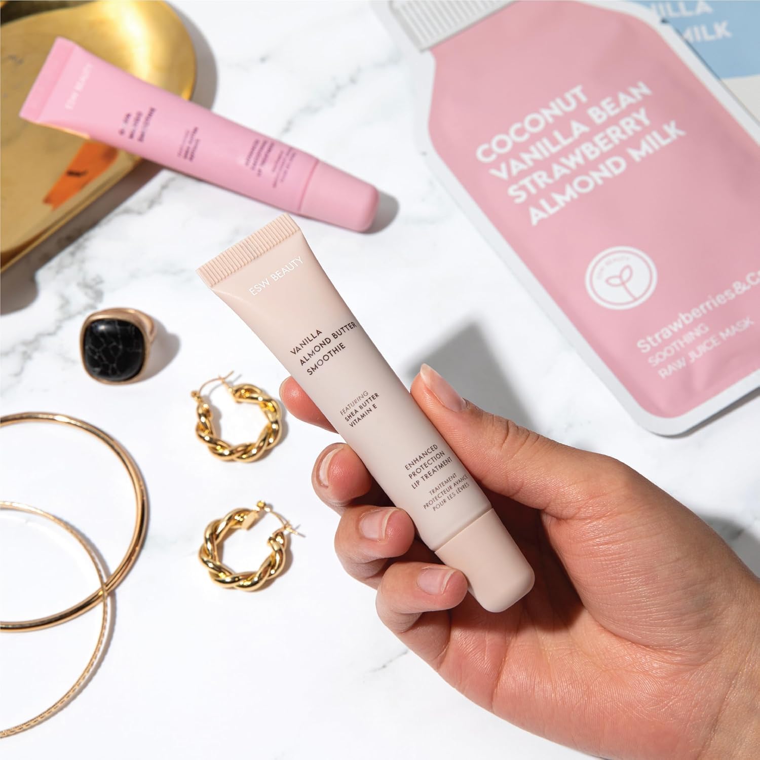 ESW Beauty lip tint in light caramel shade on lips.