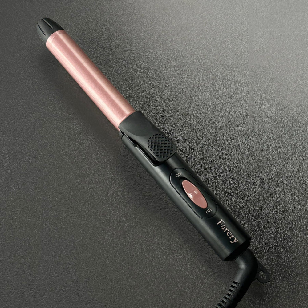 Rizador FARERY en tono rosa dorado, diseño compacto.