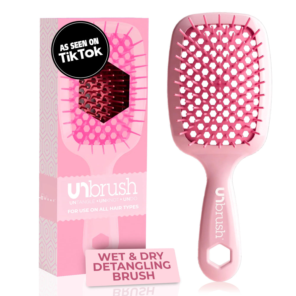 UNbrush de FHI Heat, frente del peine rosa, diseño ergonómico para peinado suave.