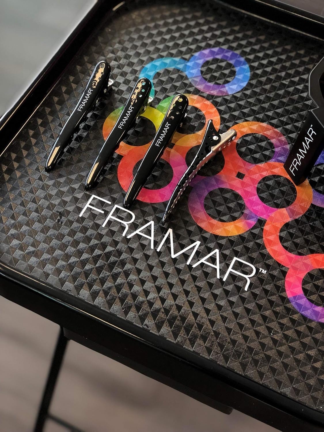 Framar clip profesional para peinado con diseño curvado