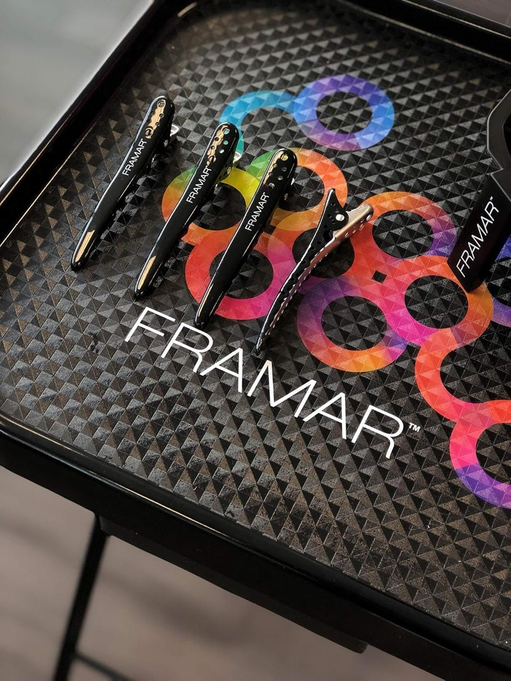 Framar clip profesional para peinado con diseño curvado