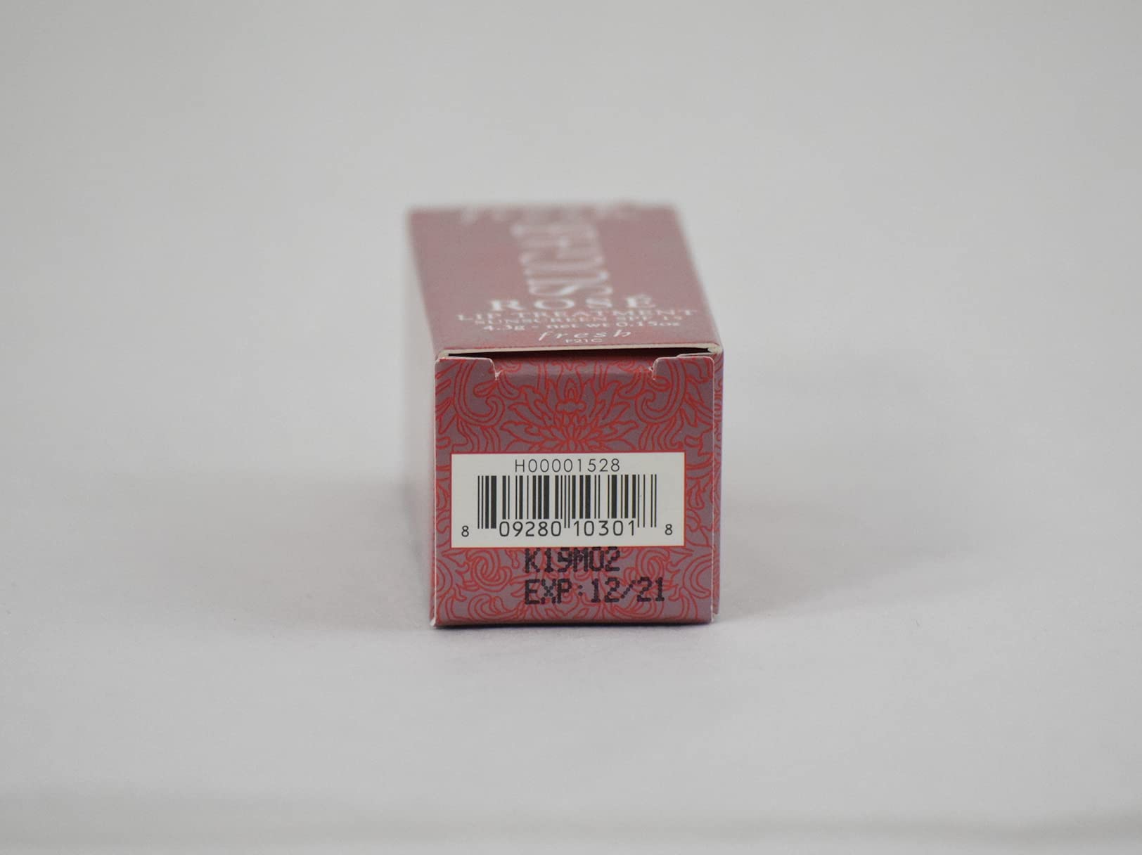 Fresh Sugar Lip Treatment SPF 15 Rose bottle close-up with luxurious finish.