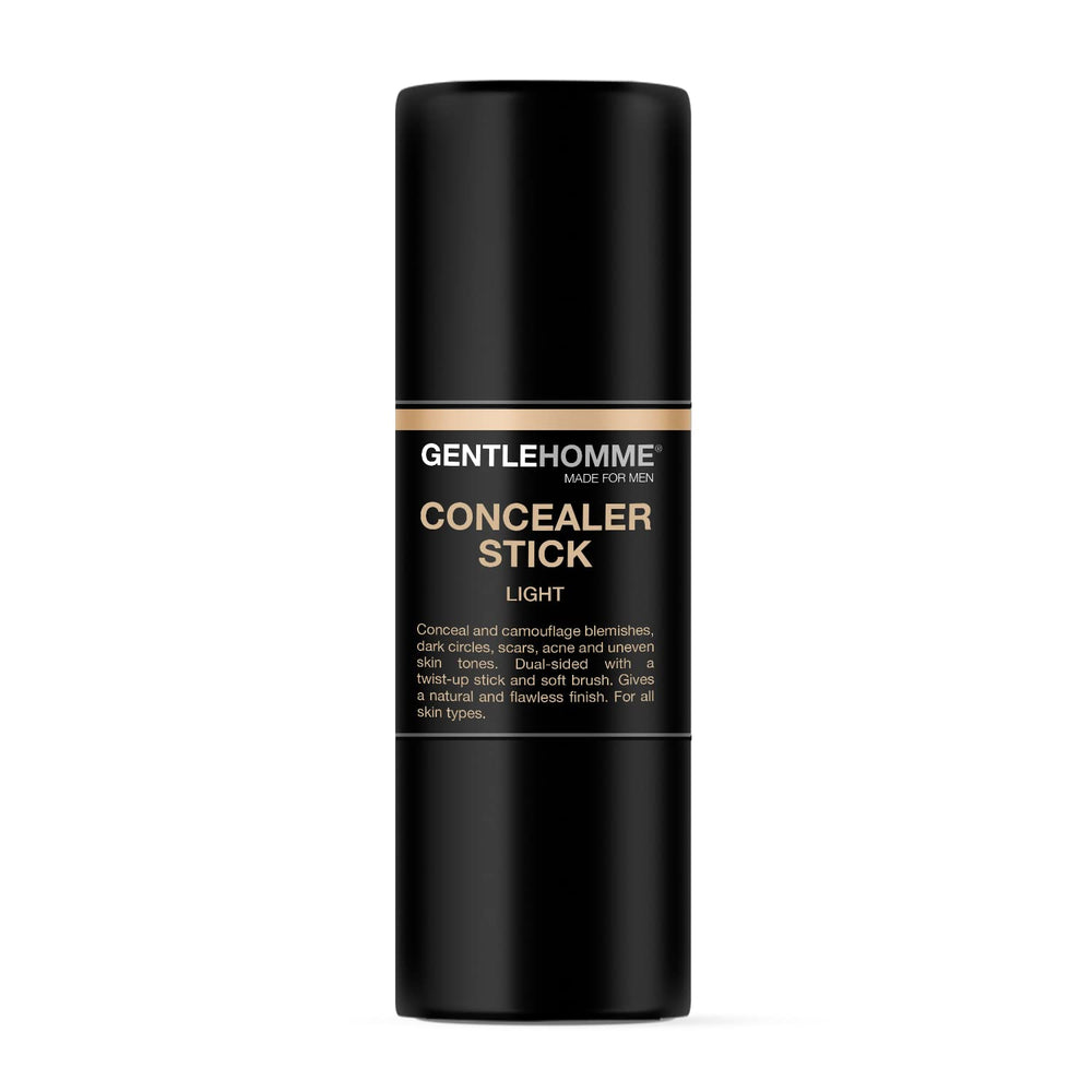 Gentlehomme concealer stick features a built-in brush for smooth blending.