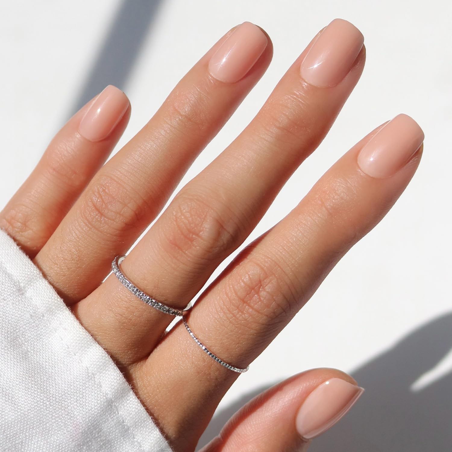 Glamnetic GlamZilla press-on nails in short squoval nude for chic salon-quality wear.