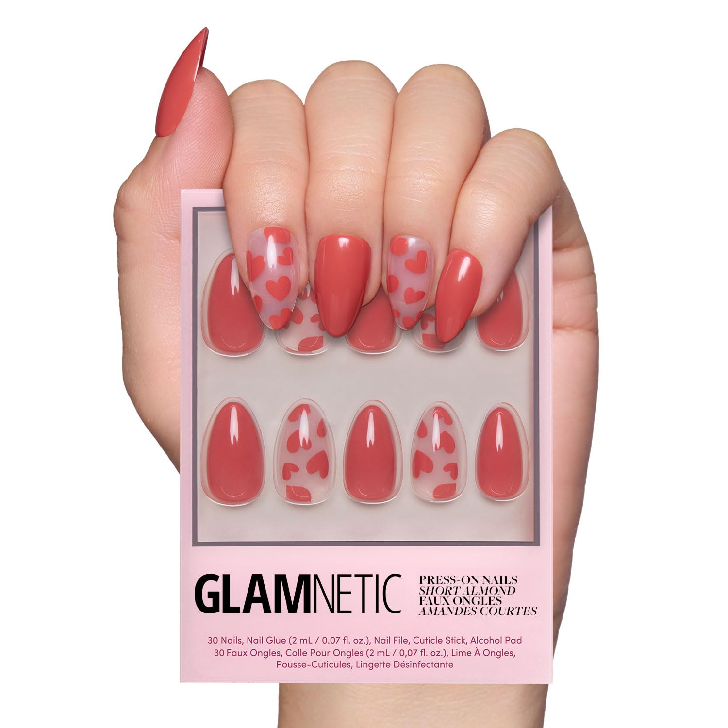 Glamnetic Love Me: uñas postizas en almendra con corazones rojos sobre base semitransparente.