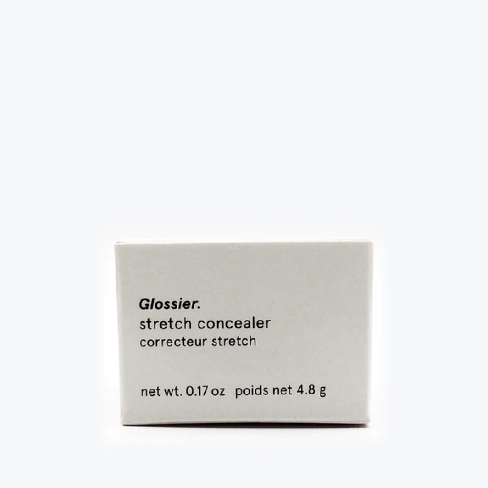 Application précise sur une imperfection avec Glossier G10 pour camoufler discrètement.
