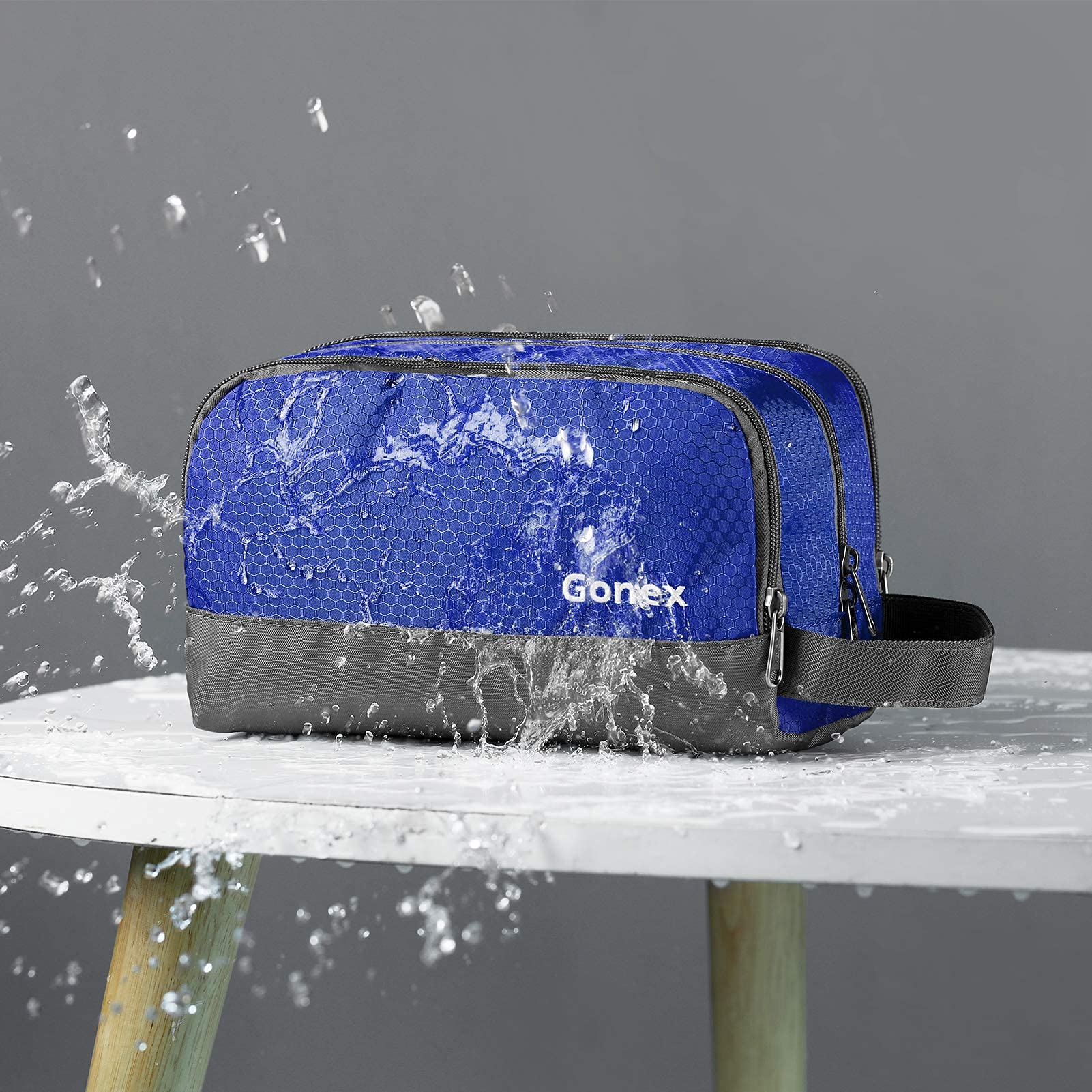 Gonex bolsa de aseo con compartimentos visibles para cosméticos.