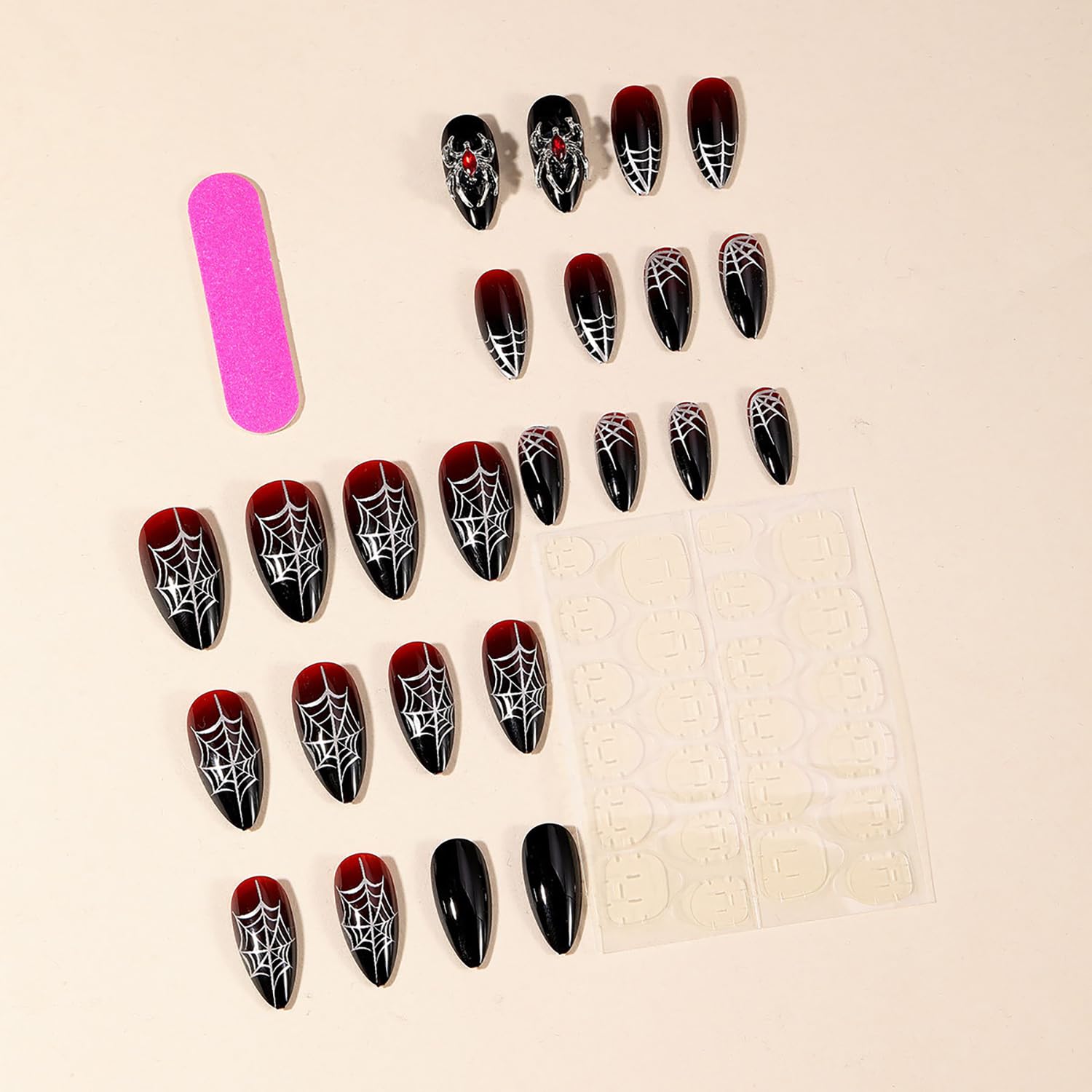 GRITOSE uñas Halloween con diseño de araña y cristales brillantes.