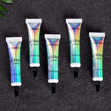 Waterproof finish of glitter glue suggests durable wear.
