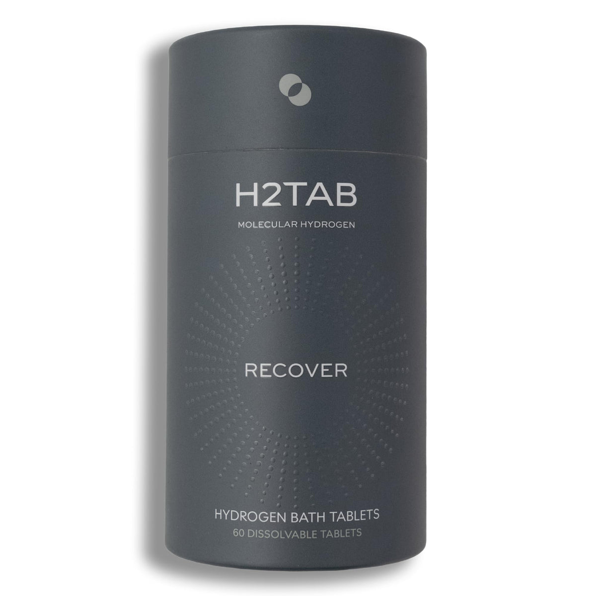 Tableta H2TAB de baño hidrógeno disolviéndose en agua para relajación muscular.
