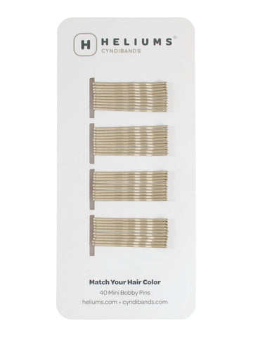 Heliums mini horquillas rubio ceniza; acabado discreto en cabello fino.