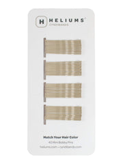Heliums mini horquillas rubio ceniza; acabado discreto en cabello fino.