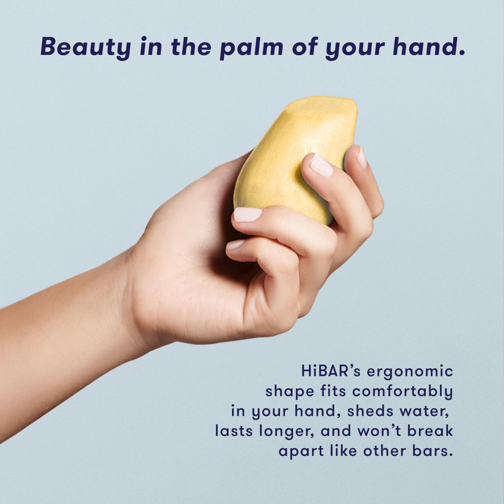 Compact Volumize Bar sits in travel tin for on-the-go care.