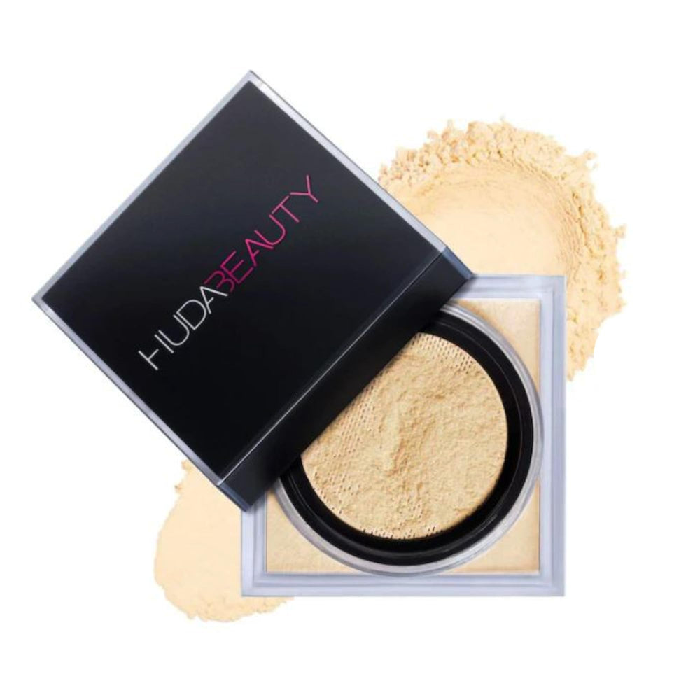 Huda polvo suelto ligero en envase compacto, acabado suave y duradero.