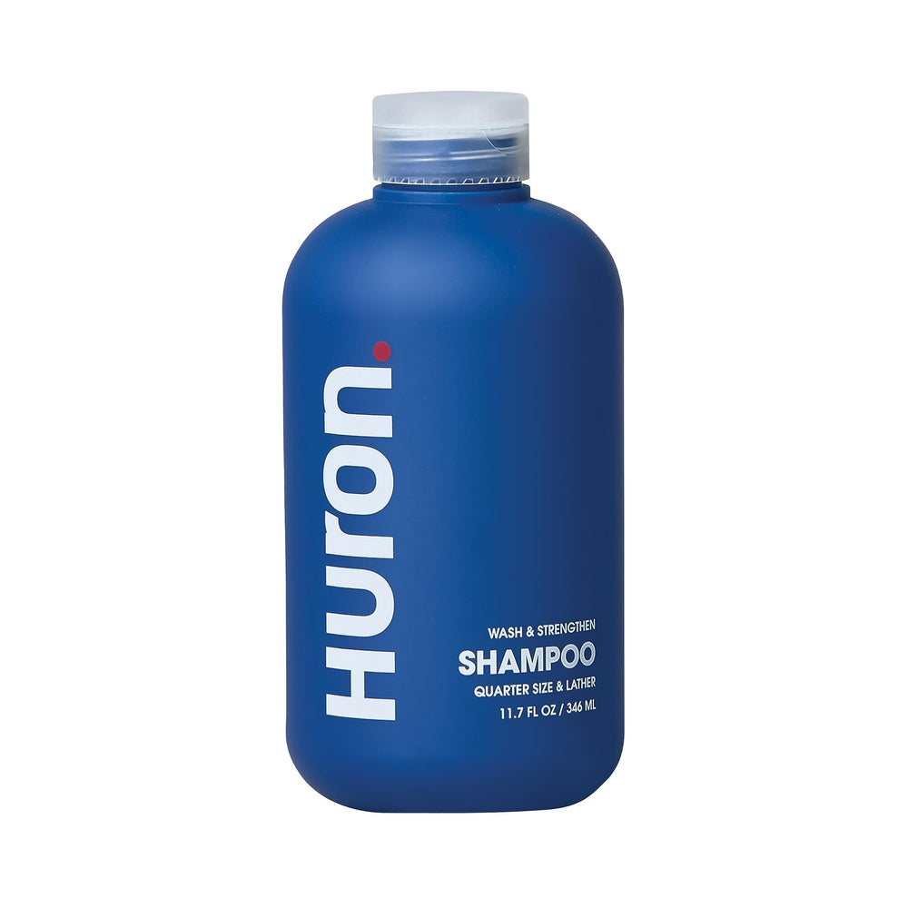 Huron Men's Shampoo bottle showing the hydrating formula for daily refreshment