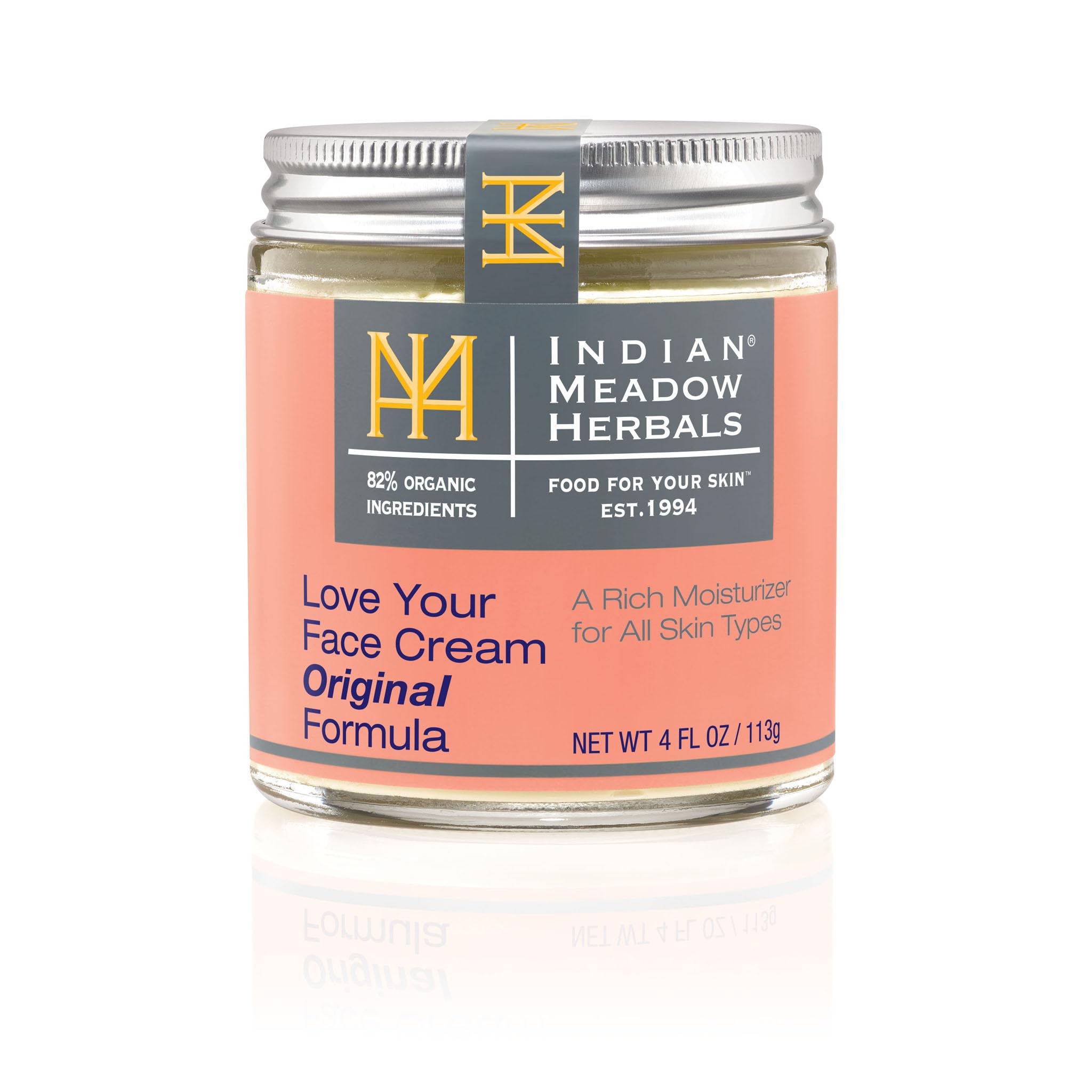 Love Your Face Cream de Indian Meadow Herbals muestra textura cremosa y piel nutrida.