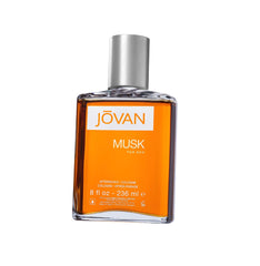 Botella de vidrio de Jovan Musk para hombres con frasco naranja, aroma seductor para uso diario.