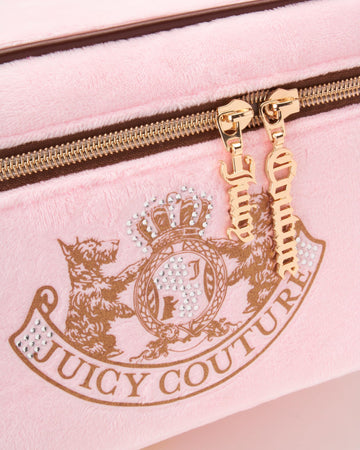 Diseño compacto de viaje Juicy Couture para optimizar tu equipaje.