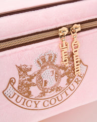 Diseño compacto de viaje Juicy Couture para optimizar tu equipaje.