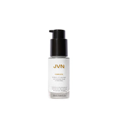 Envase de JVN Complete Blowout Milk, crema ligera para peinar y proteger del calor.