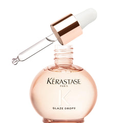 Kérastase Gloss Absolu Glaze Drops, botella elegante para brillo intenso sin grasa.