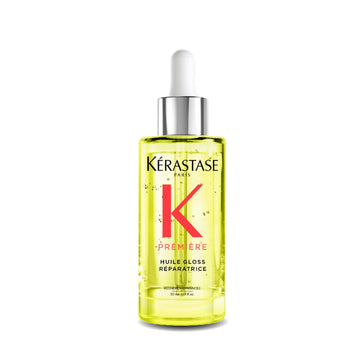 KÉRASTASE Première Aceite Reparador, botella para protección térmica y brillo duradero.