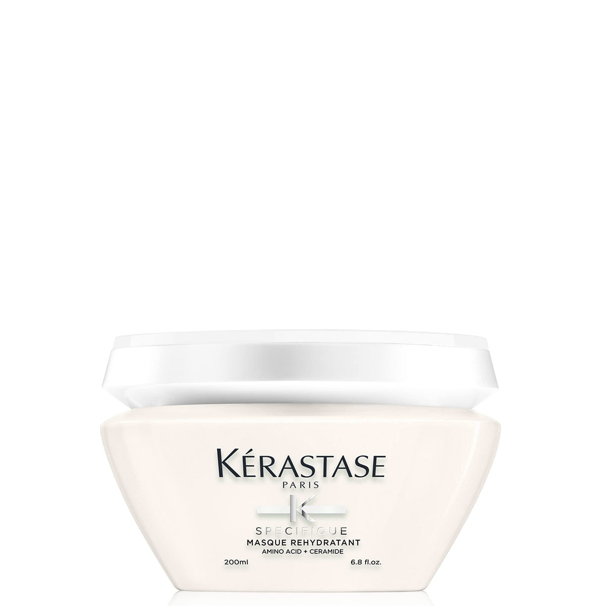 Kérastase Specifique Rehidratante en botella, facilita desenredar y revitaliza el cabello.