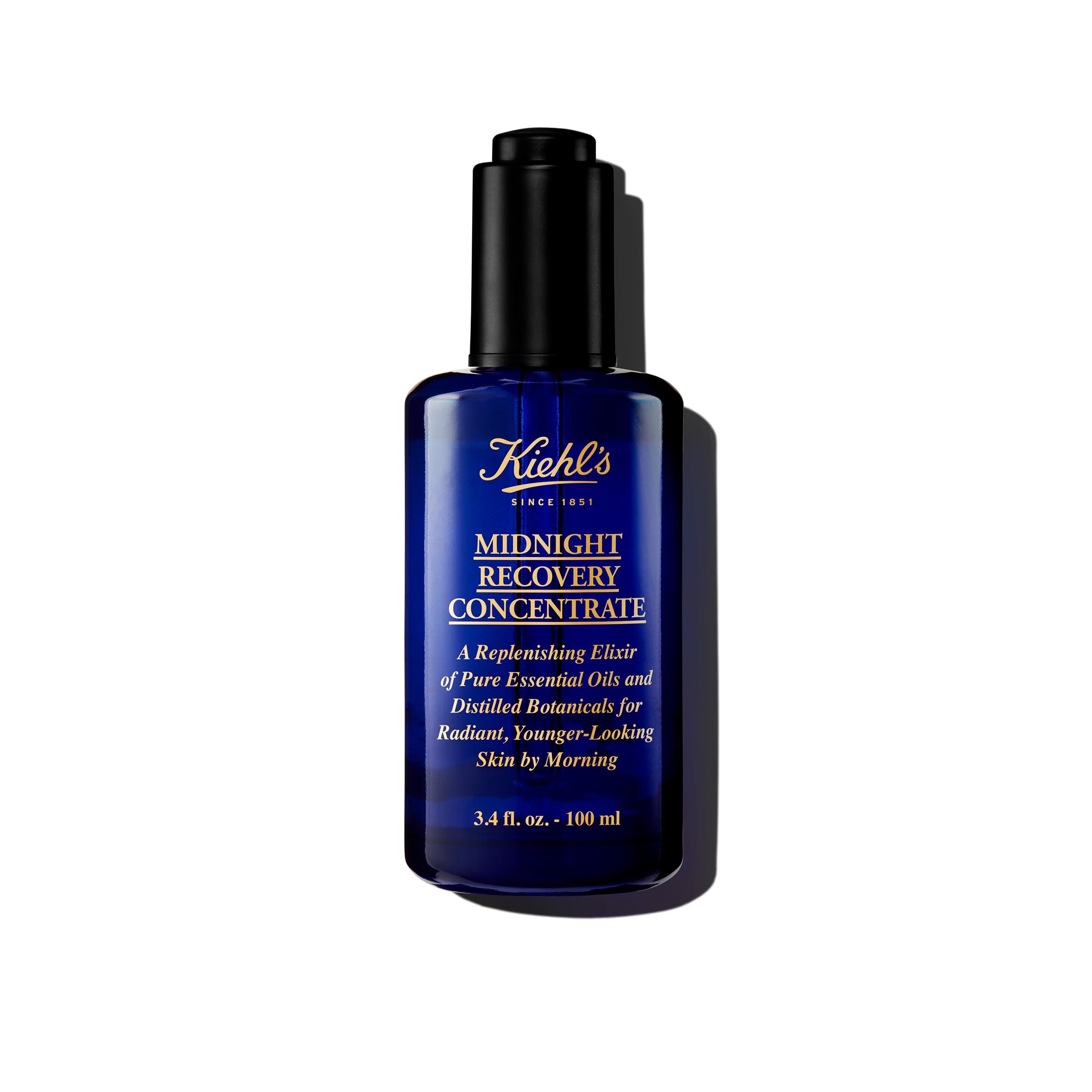Kiehl's Midnight Recovery Concentrate en botella, ideal para piel suave durante la noche.