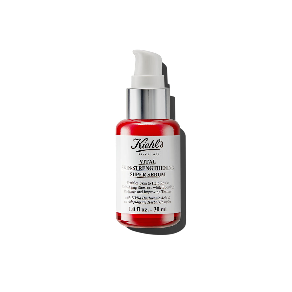 Kiehl's Vital Skin serum con ácido hialurónico, botella enfocada en brillo facial.