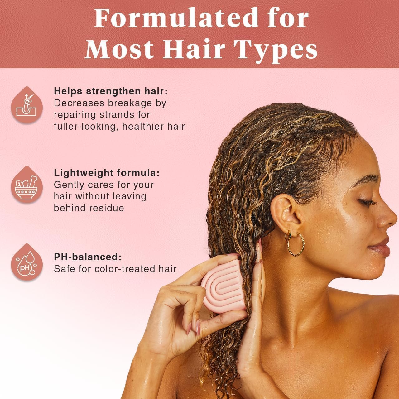 Kitsch Castor Oil Conditioner Bar being applied to damp hair for even distribution.