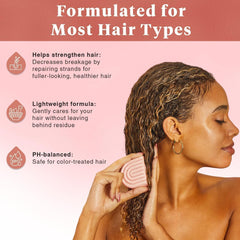 Kitsch Castor Oil Conditioner Bar being applied to damp hair for even distribution.