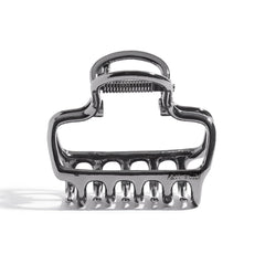 Kitsch clip de pelo hematita, primer plano, agarre firme para mechones.