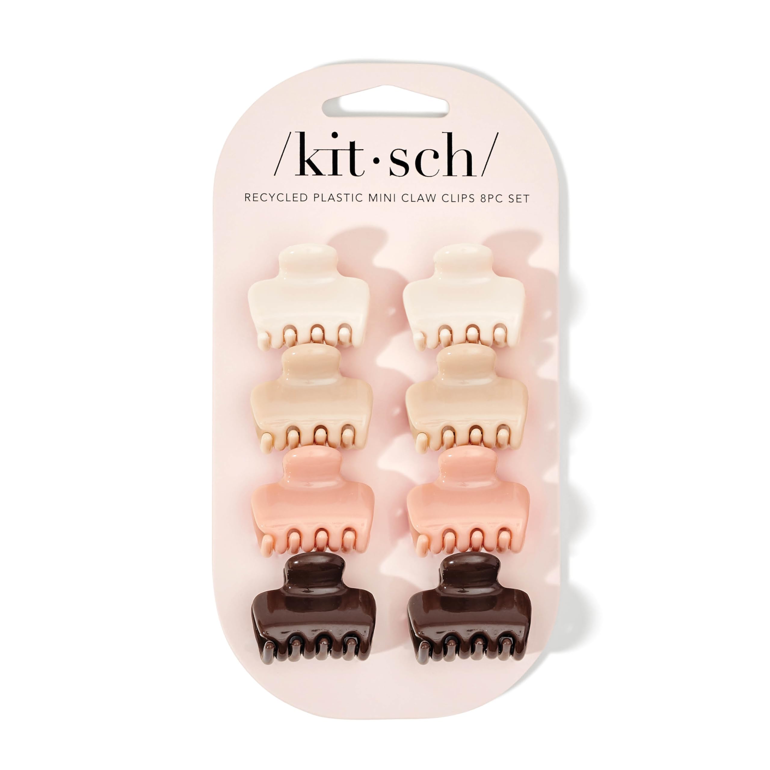 Kitsch pinzas de pelo mini en rosewood, mostradas en mano.