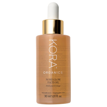 KORA Organics Noni Glow: botella de aceite facial para hidratación suave y brillo natural.