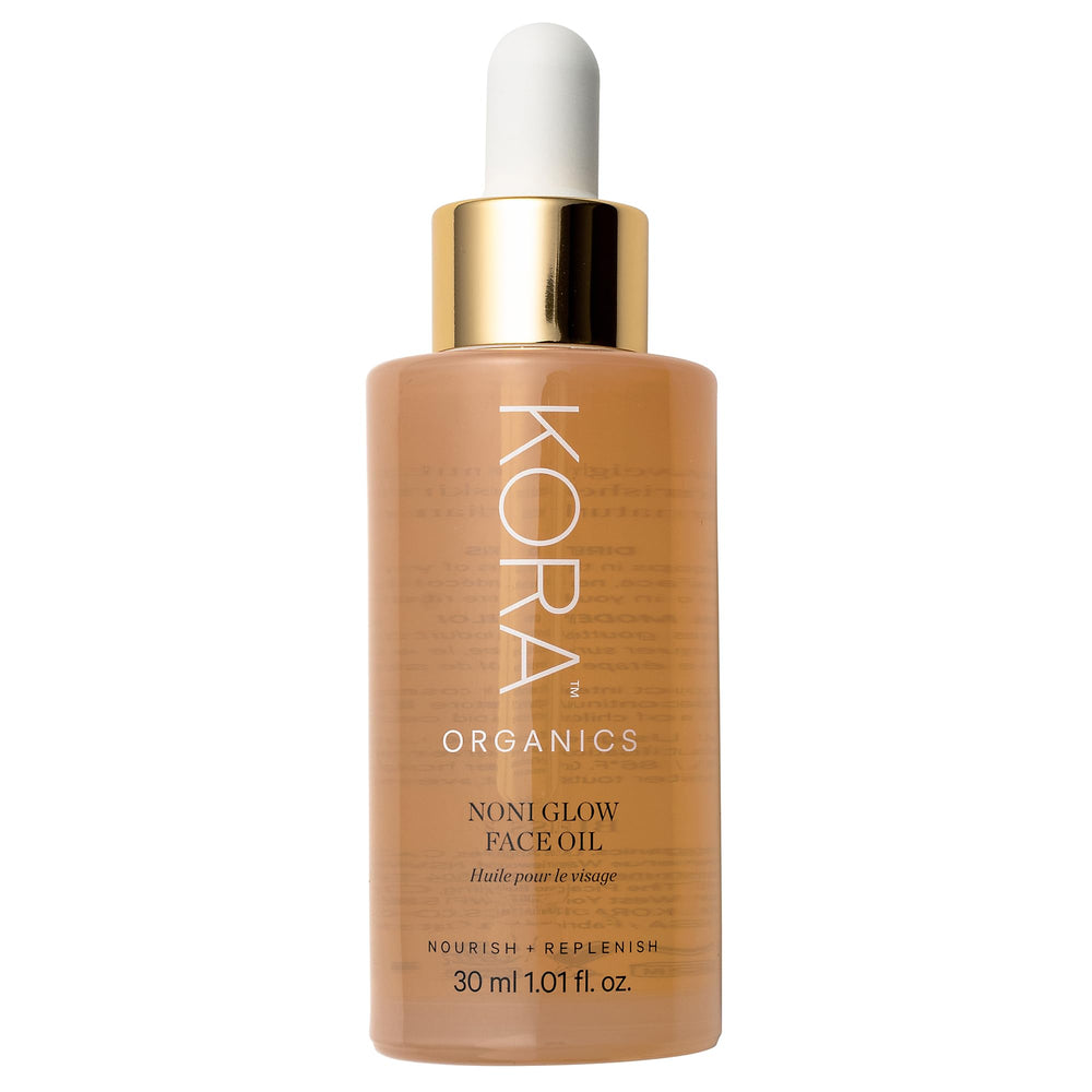 KORA Organics Noni Glow: botella de aceite facial para hidratación suave y brillo natural.