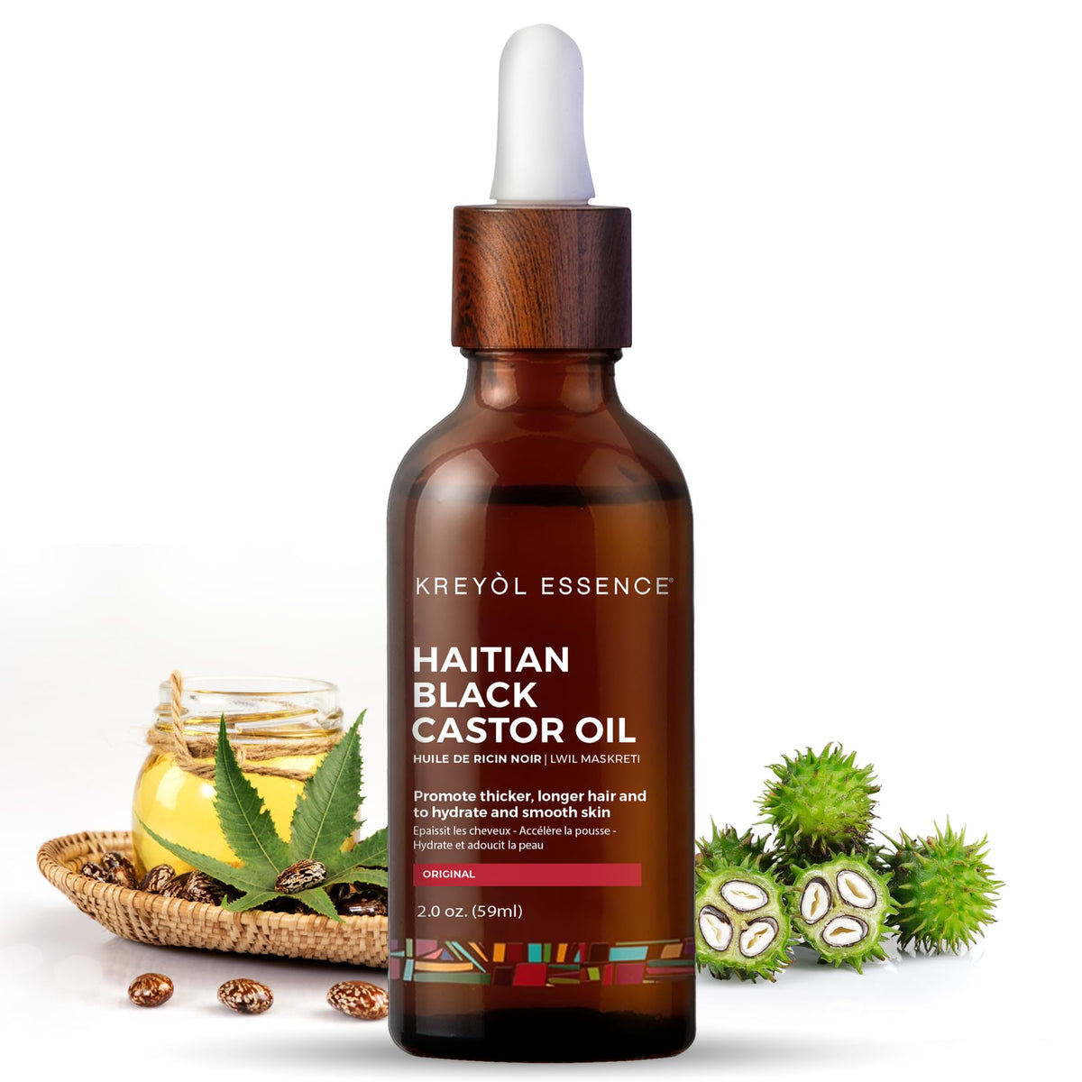 Kreyol Essence aceite negro haitiano en botella de vidrio, hidratación profunda para cabello.
